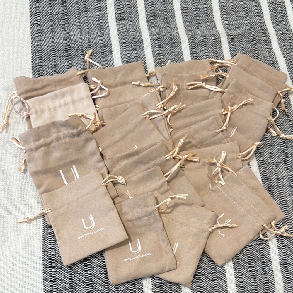 Uncommon James Beige jewelry Drawstring Bags